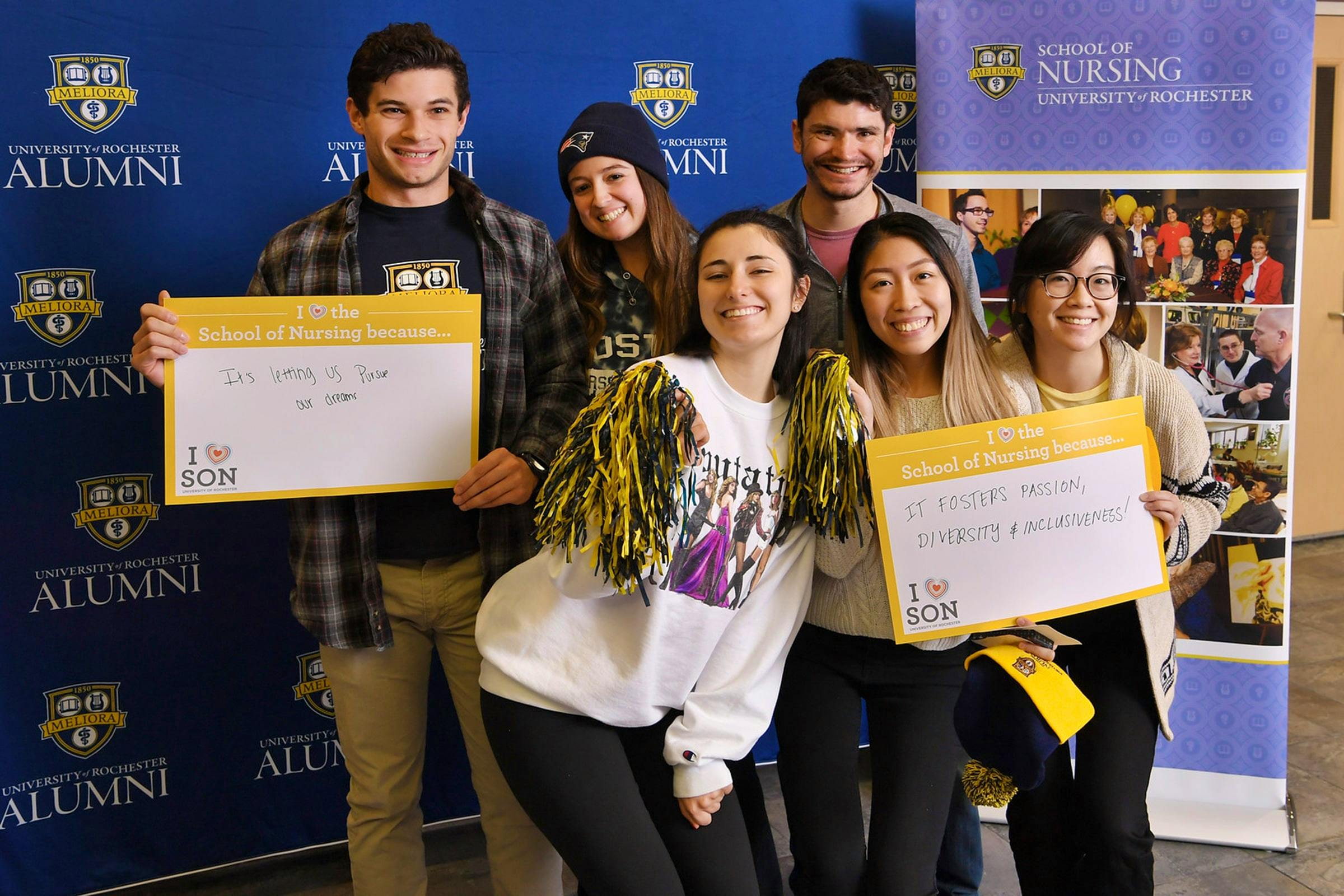Group of ABSN students with signs about doing the accelerated nursing program