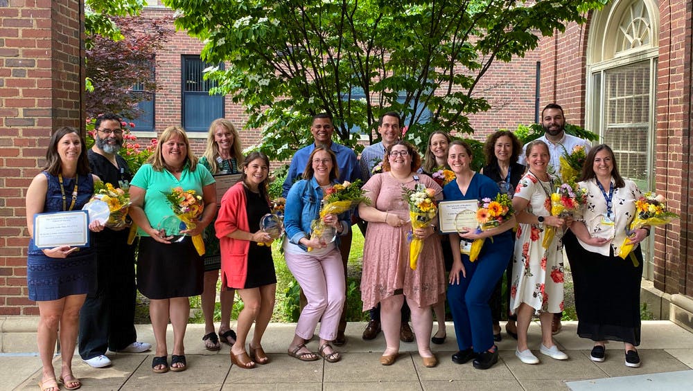 Staff at the School of Nursing holding their awards
