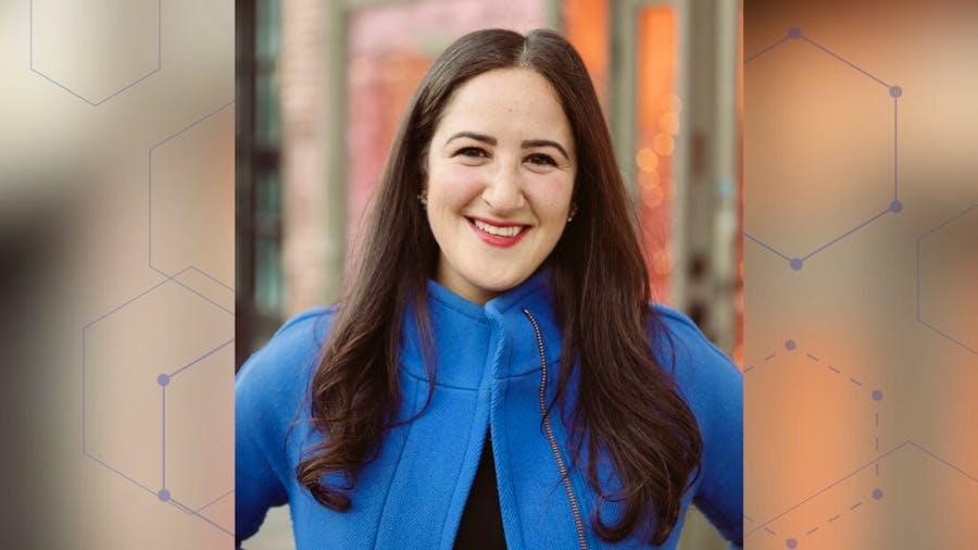 Professional headshot of Lauren Ghazal wearing a blue coat