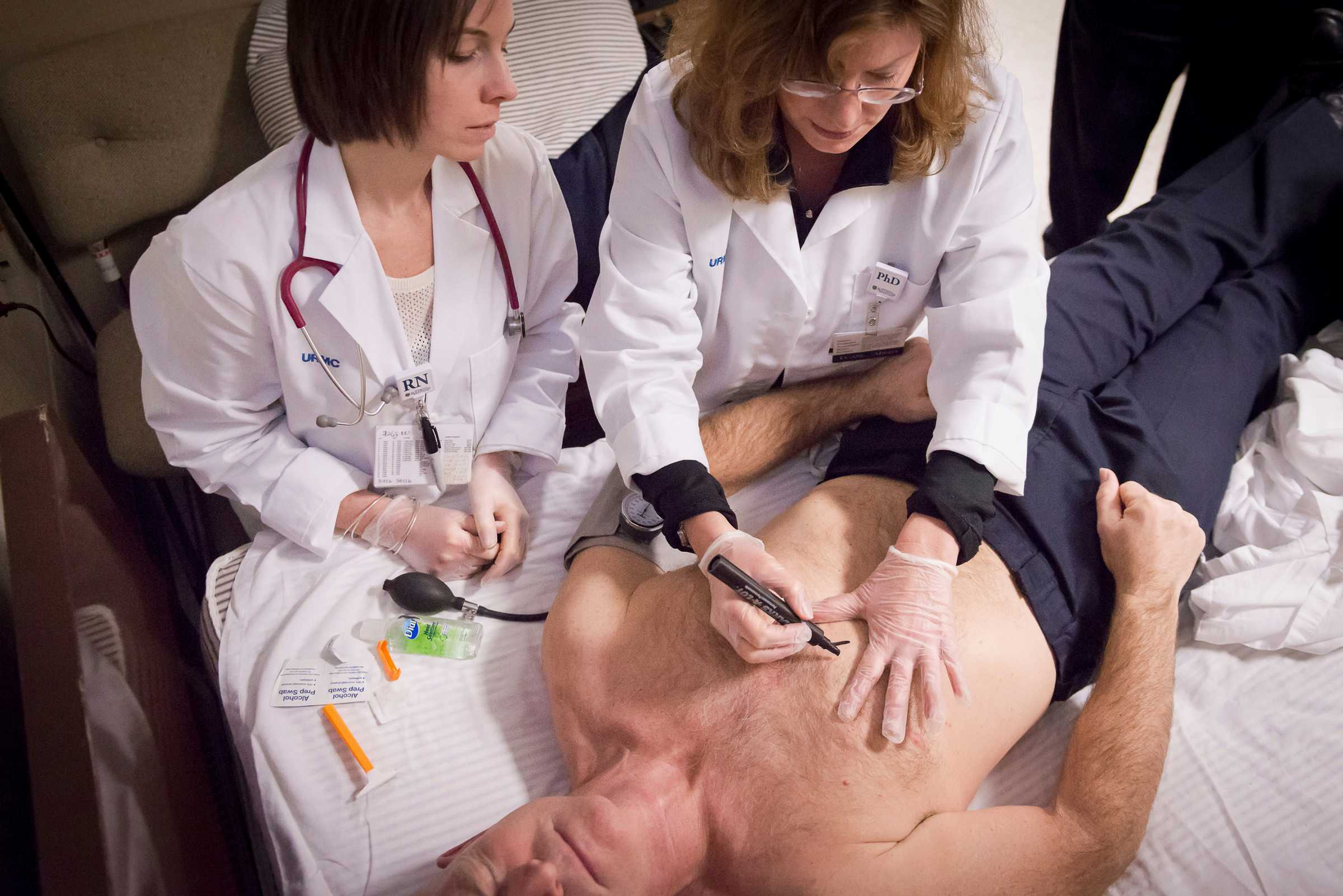 Cancer patient speaking the nurse researcher with white coat.